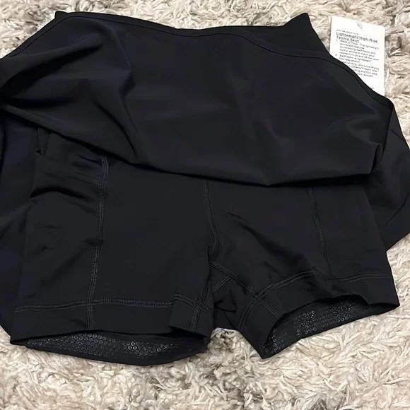 Lululemon lightweight high-rise tennis skirt. Size 2. New with tag. Black.